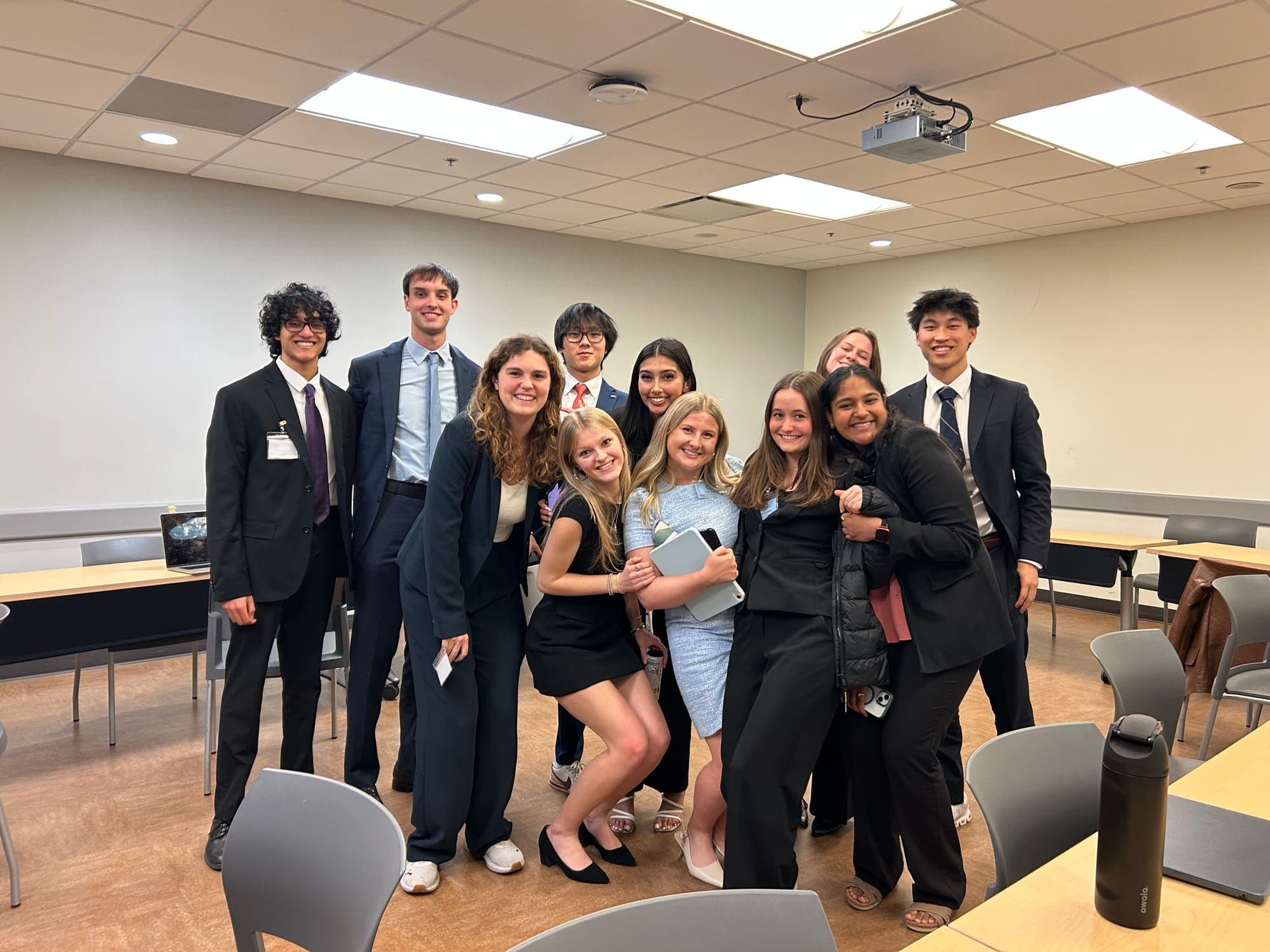 Eta Theta members in business professional attire after a chapter event