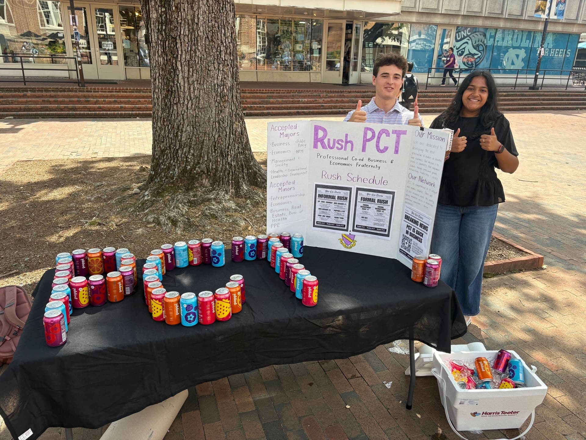 Two members at the Puppies & PCT table